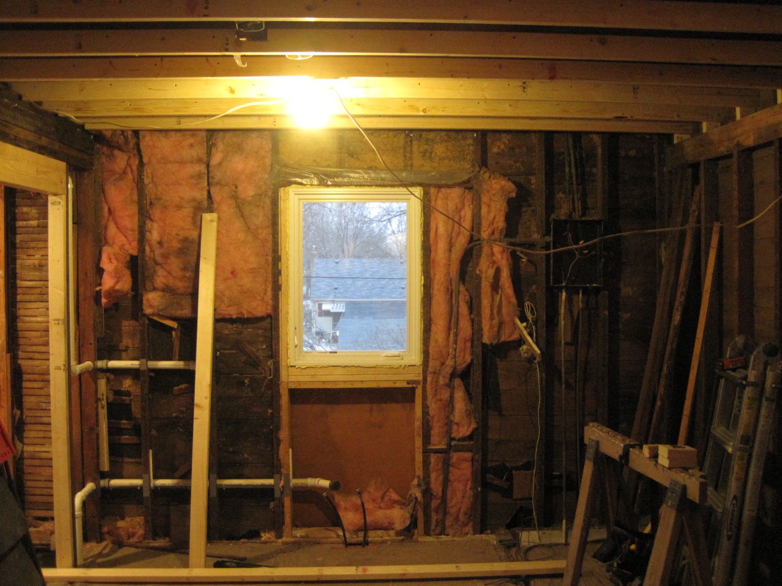 The ceiling after being leveled, now matches the lines of the new window and we no longer feel off balance when walking around in this room.