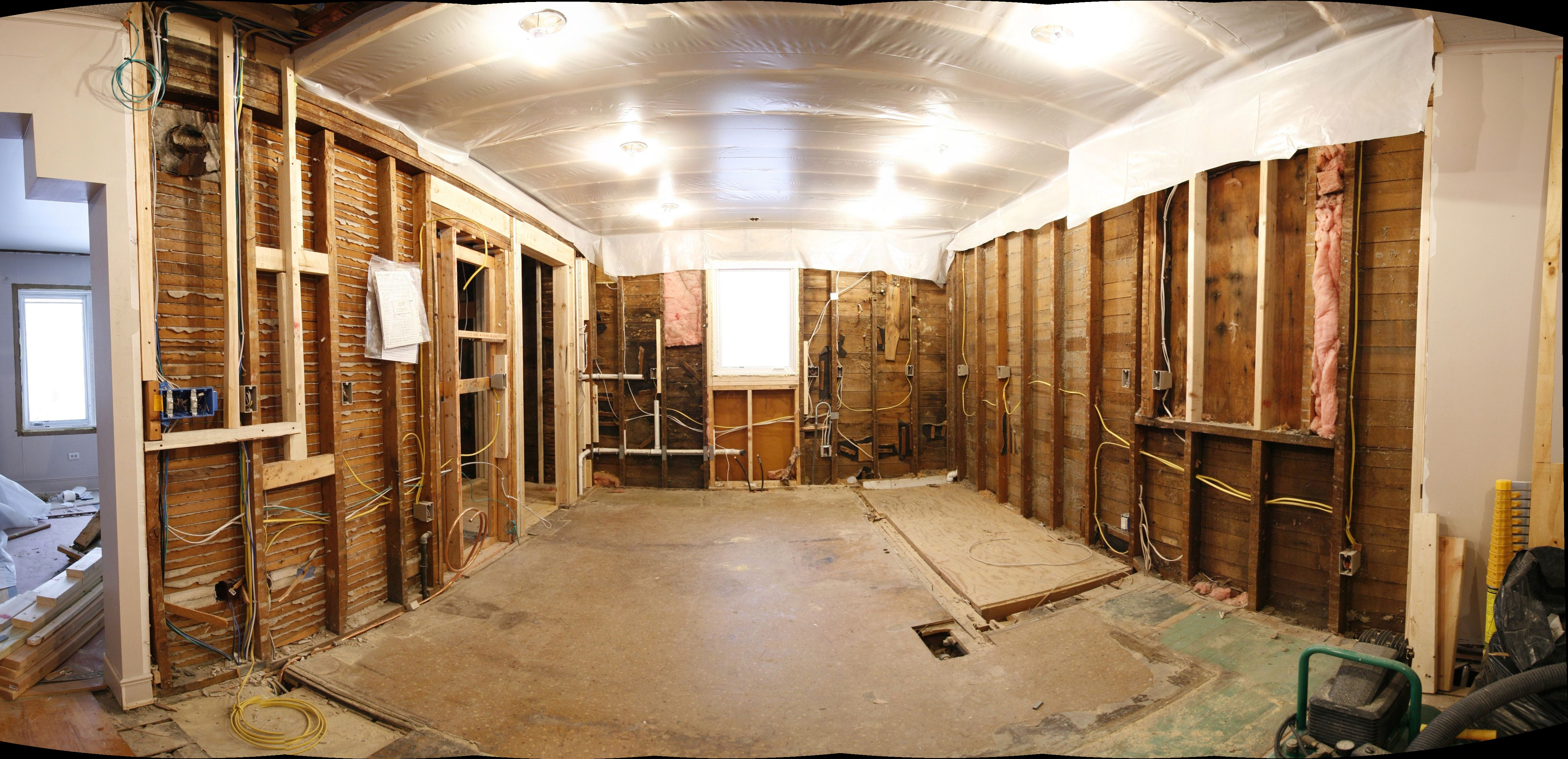 The gutted kitchen, re-plumbed, re-wired, and ready for insulation and sheet-rock.