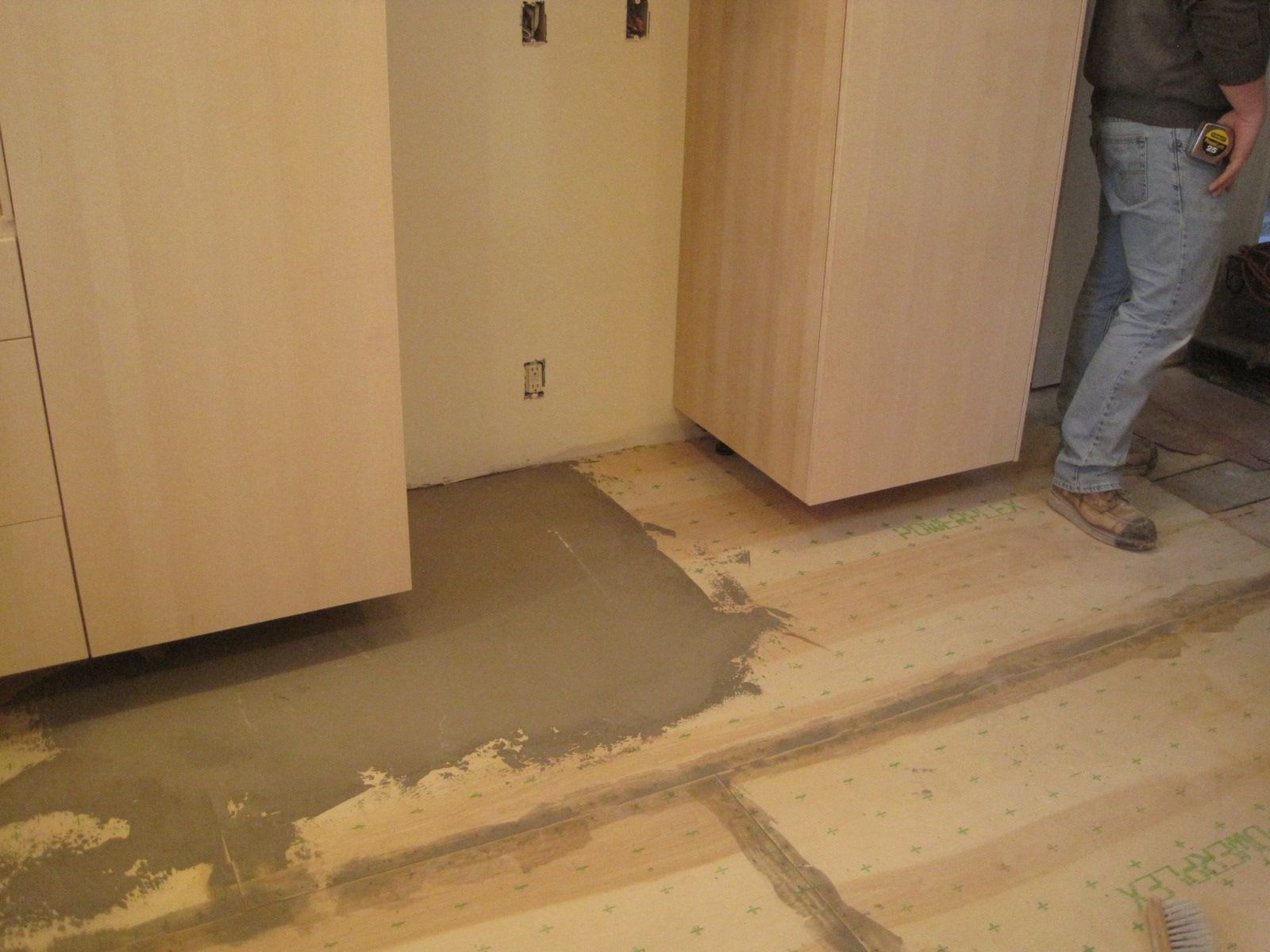 The solution:  floor cement filler, troweled smooth, but not necessarily level.