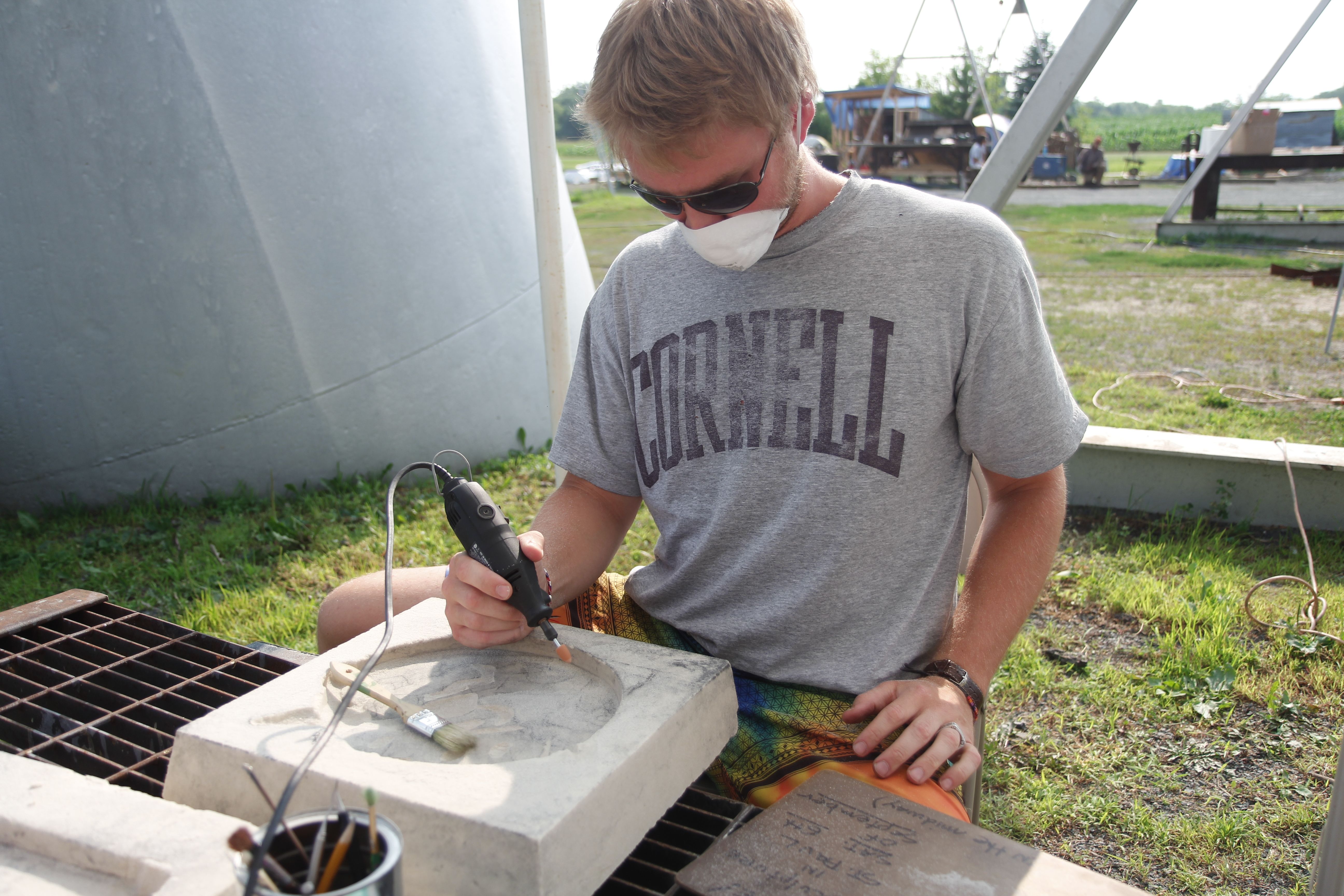 Carving the sand block.