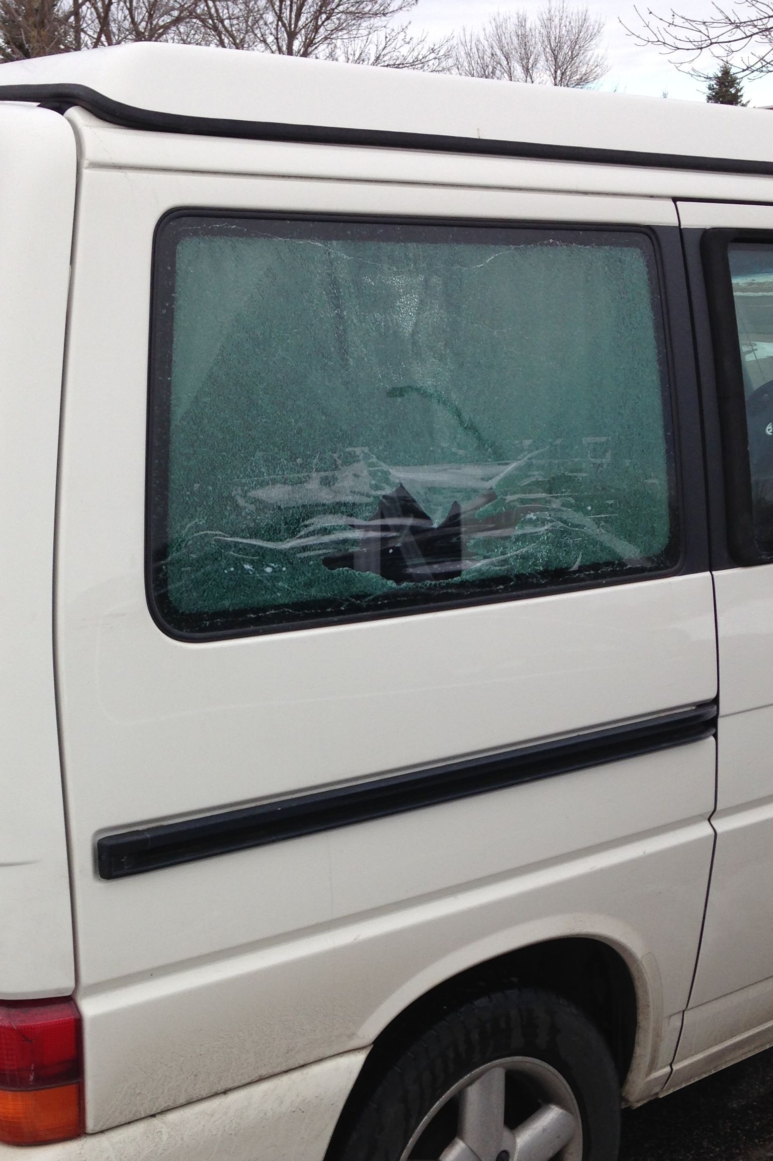 The rear passenger side window, shattered by a tipping bandsaw!