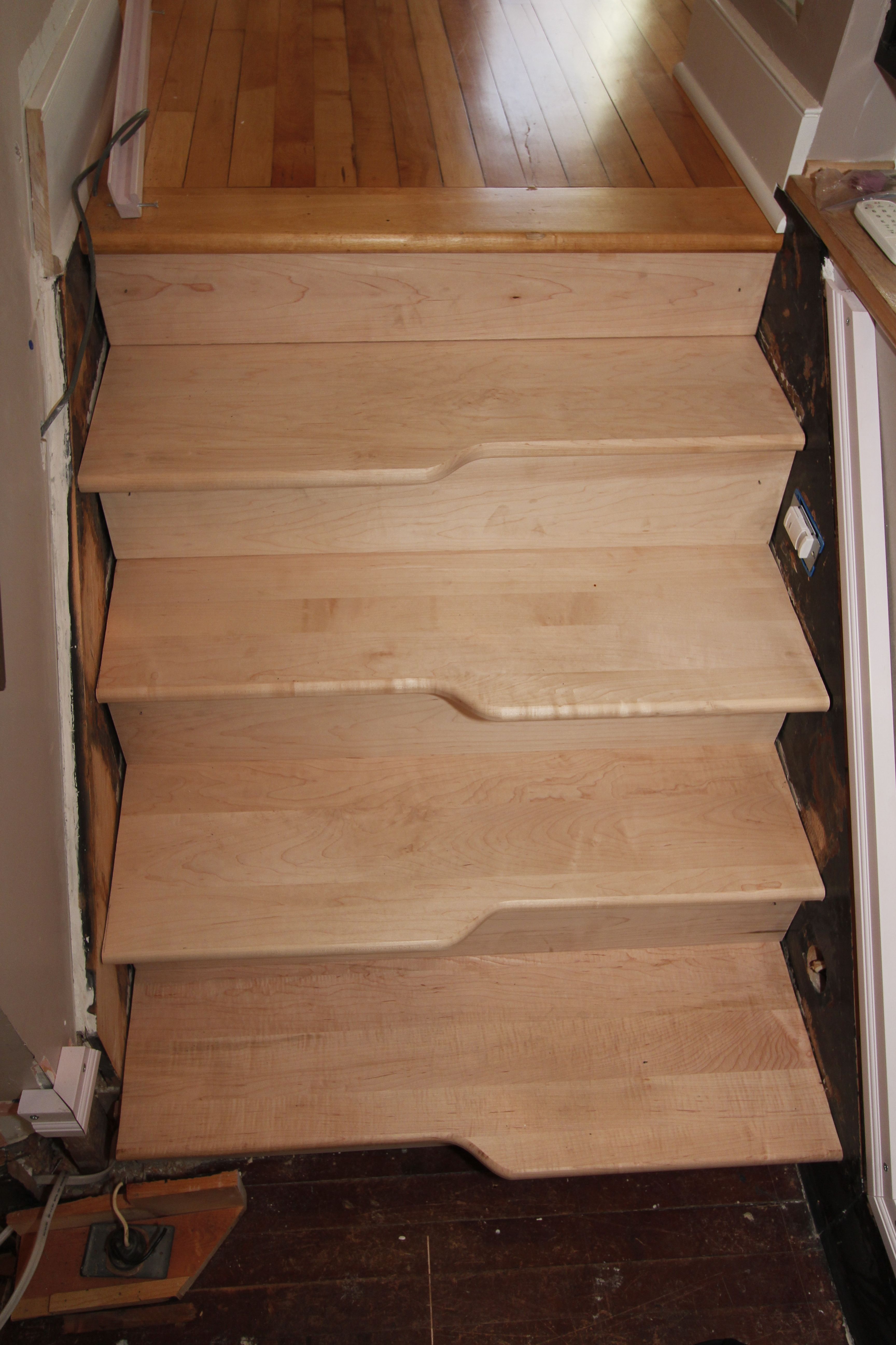 The top four steps from the landing to the second floor were the training ground where I learned the methods for making and installing custom treads and risers.